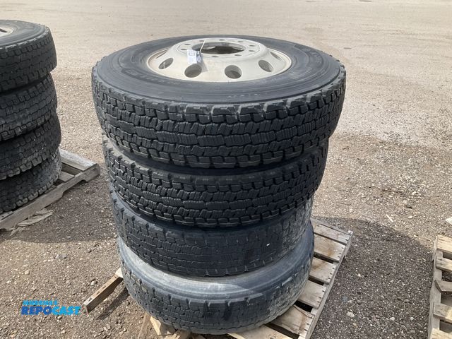 Lot 2-11833 - (4) recap 275/80R22.5 tires on aluminum wheels, used