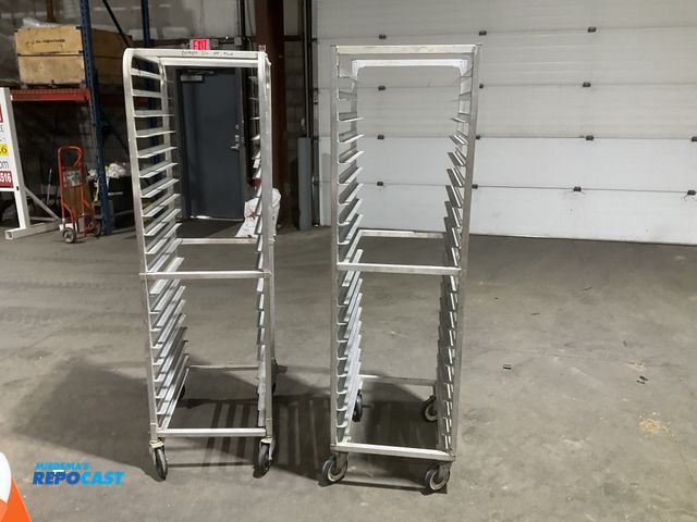 Lot 2-55143 - Lot of (2) 20” width x 69” height x 26” depth aluminum bread racks. (One needs a crossmember on lowe...