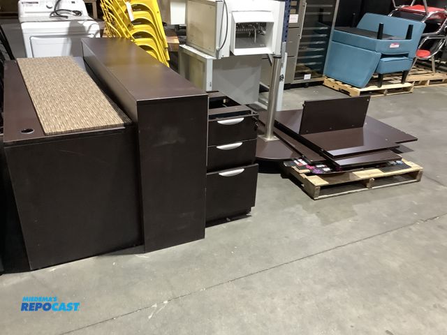 Lot 2-27777 - Skid lot of a desk with cabinets drawers and shelves stand approximately 36” at the highest part