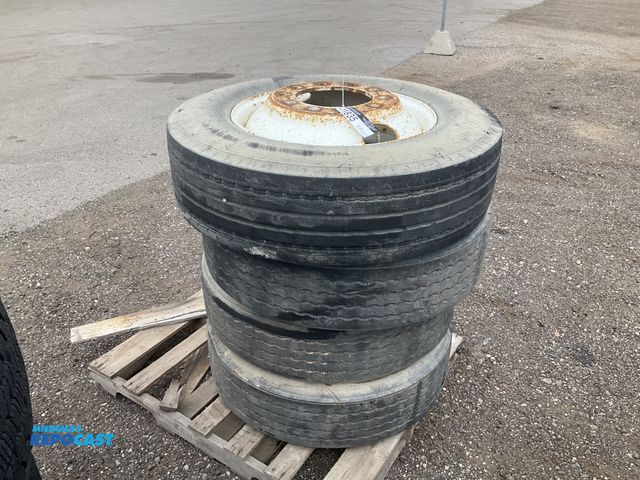 Lot 2-11835 - (4) recap 275/80R22.5 semi tires on steel wheels, used
