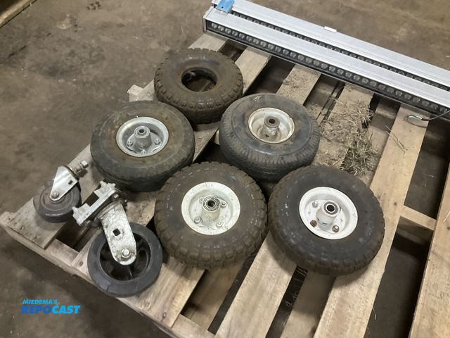 Lot 2-33258 - (5) 4.10/3.50-4 tires (one without rim) and (2) casters, used