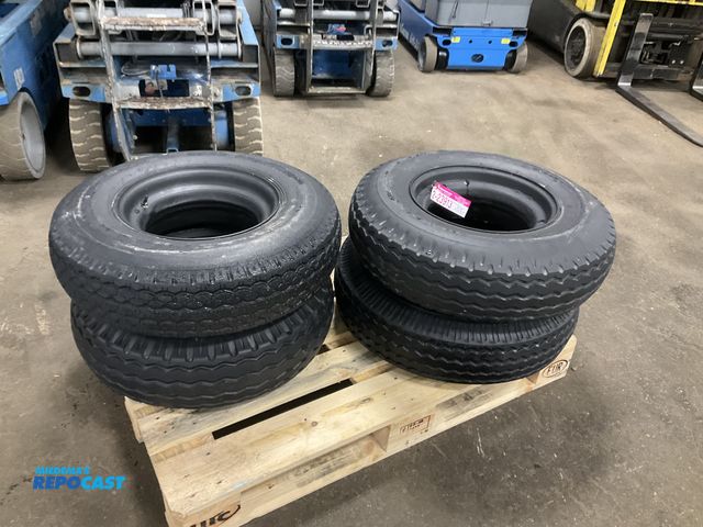Lot 2-23913 - (4) 8-14.5 tires on steel mobile home style wheels, used
