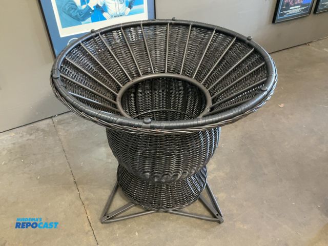 Lot 2-11563 - Black synthetic hourglass outdoor table with metal base (top isn’t included) with measurements of ap...