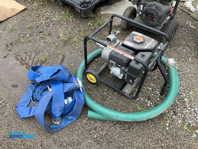 Lot 2-33608 - Champion 163cc semi-trash water transformer pump and (2) hoses - used only once