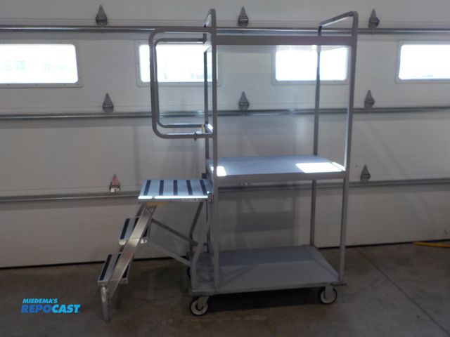 Lot 2-34111 - Commercial National Cart Company stocking cart. Three shelves. 300 pound rated steps. Locking castor...