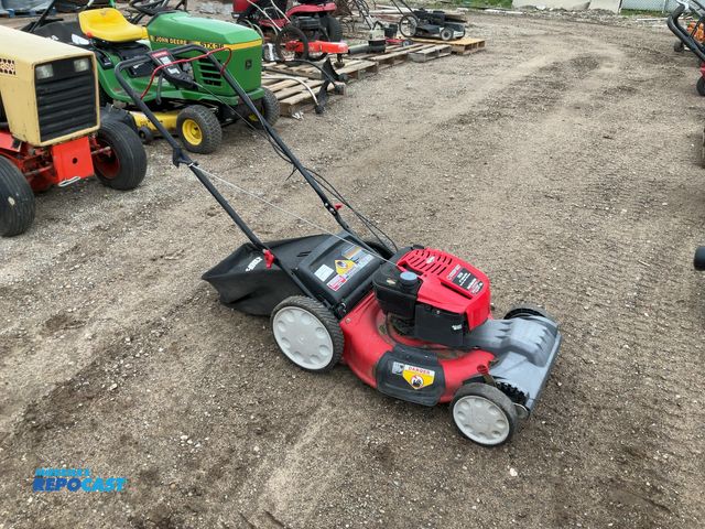 Lot 2-94906 - troy bilt model tb-230 self propelled, walk behind lawn mower with a rear lawn bagger attachment. ha...