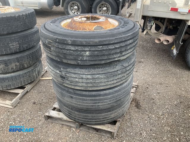 Lot 2-11831 - (4) 295/75R22.5 semi tires on steel wheels, used