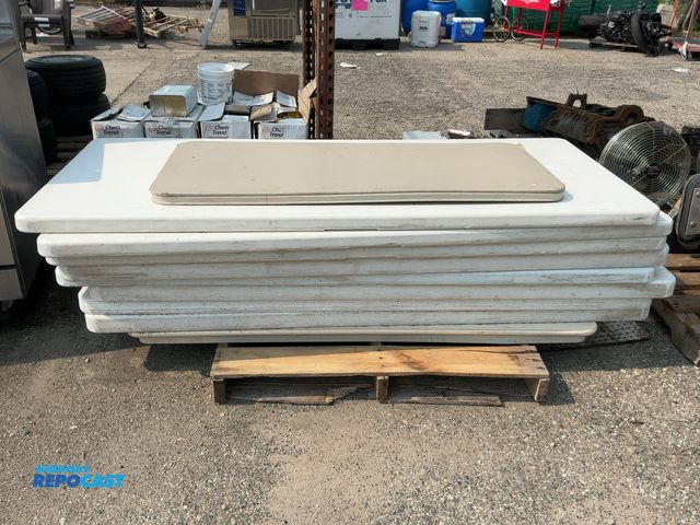 Lot 2-18197 - Skid lot of white plastic folding tables and 1 smaller brown table