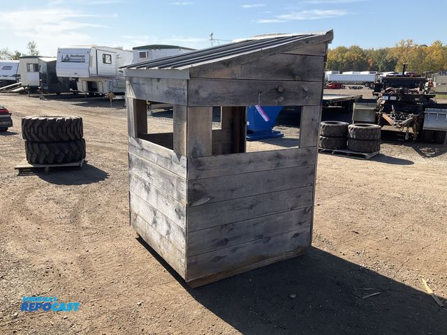 Lot 2-20690 - Homemade wood deer blind with a metal covered slanted roof 52”W x 50” x 80”T (on the high side), win...