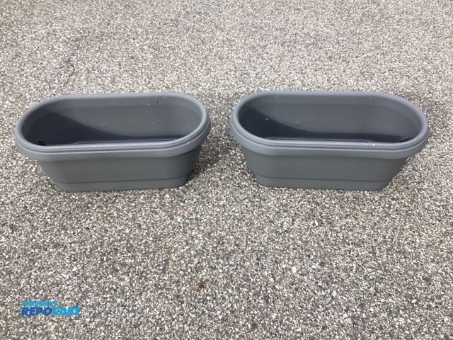 Lot 2-92872 - Two new Bloem Living 24” Deckrail planters. Fits on the rails of a deck. Sits tightly on 2“ x 4“ and...