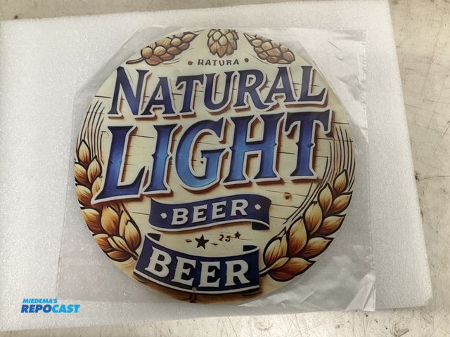 Lot 2-67043 - New 7.75” diameter Natural Light themed tin sign