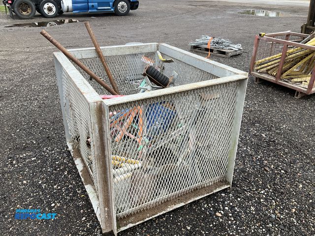 Lot 2-40706 - Metal crate with misc construction items in it including pipe stands, roller stand, cable slings, an...