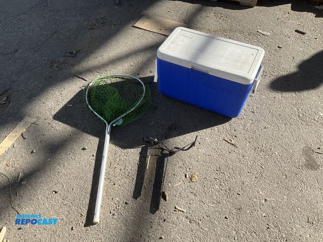 Lot 2-55533 - Used Coleman cooler, fishing net and (2) fishing rod holders. All proceeds go to Helen Devos Childre...
