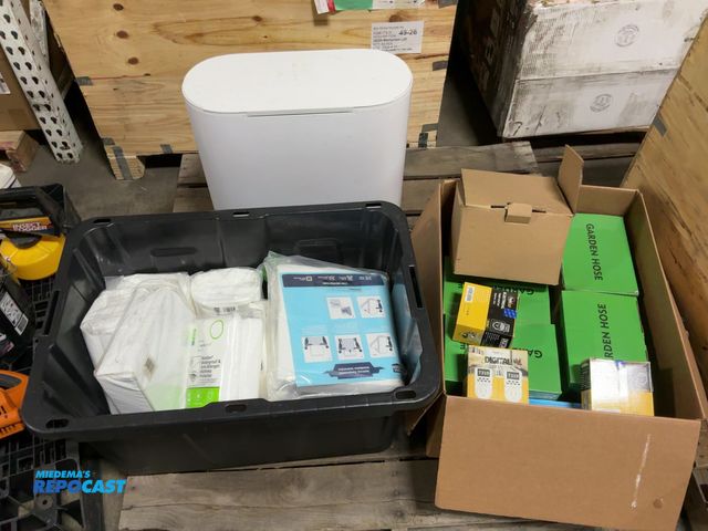 Lot 2-69674 - Skid of miscellaneous household items. Includes mattress protectors, garden hoses, digital timer soc...