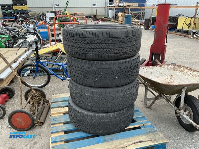 Lot 2-69597 - (4) tires including a general Altimax RT45 tire and (3) Bridgestone blizzak DM-V2 tires (no rims)
