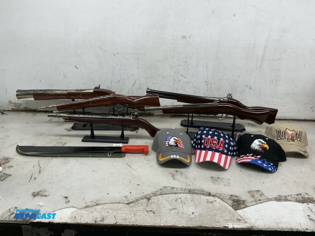 Lot 2-76889 - lot includes: (5) asst. Replica wood and plastic Rifles - between 21"-25" , long stands are includes...