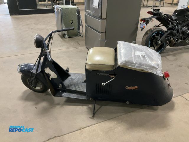 Lot 2-92146 - 1946 Cushman turtle scooter Model 60 Moped Cushman scooter with new parts and manuals.