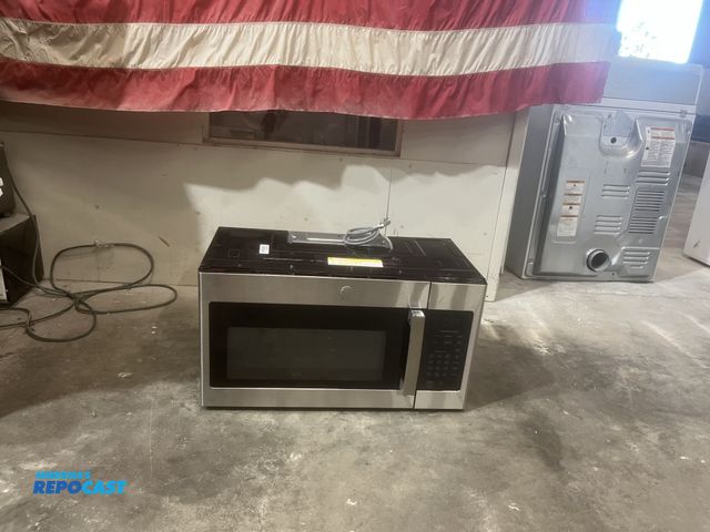 Lot 2-59377 - GE over the hood Microwave Oven black and stainless
express cook
surface light