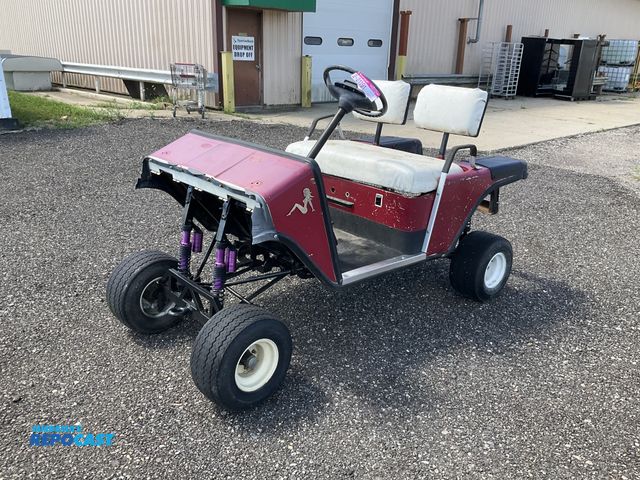 Lot 2-21191 - EZGO golf cart project, was an electric cart being converted to a gas cart (no engine or batteries),...