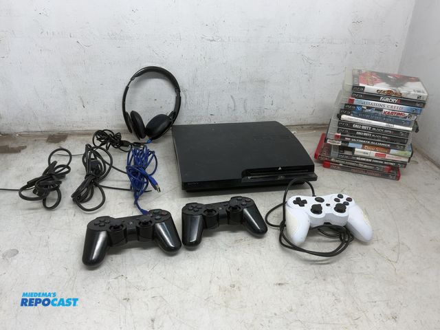 Lot 2-63347 - . . Various PS3 and 2 Games, Controllers, Cords, Headphones, and a Sony PlayStation 3