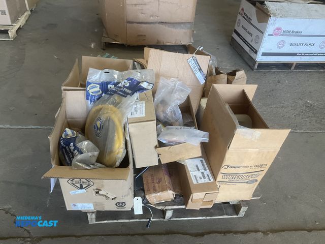 Lot 2-11690 - Skid of truck parts including light bulbs, cabin filters, some bearings, trailer light plugs, and mo...
