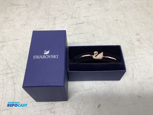 Lot 2-74140 - New Swarovski rose gold-toned swan clear crystal pave’ bracelet