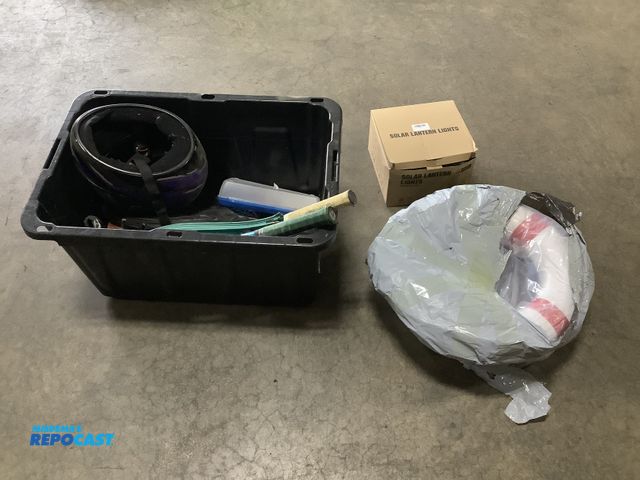 Lot 2-23095 - Plastic storage tote of miscellaneous items including: DL-002 solar lantern lights, floatation rings...