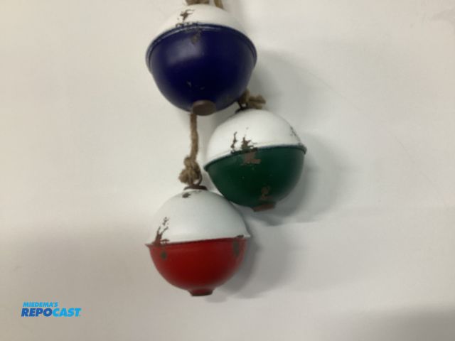 Lot 2-76424 - New distressed metal buoy decorations on a jute rope, a "Buoy Bundle" for nautical-themed decoration...