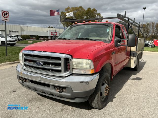 Lot 2-69302 - 2003 Ford F350 XLT Extended Cab Flatbed Pickup Truck 4x4