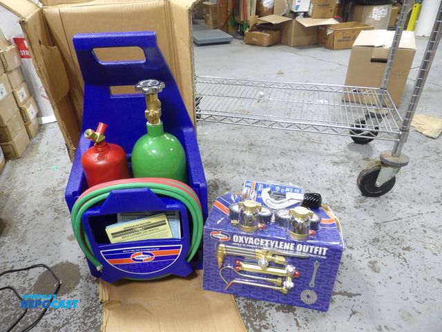 Lot 2-53870 - uniweld, welding and cutting kit, includes: carrying stand, flint lighter, goggles tank keys w/ chai...