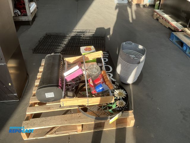 Lot 2-55485 - Skid lot of assorted household items including: new bar soap, some toys, glass coffee pot, signs, mo...