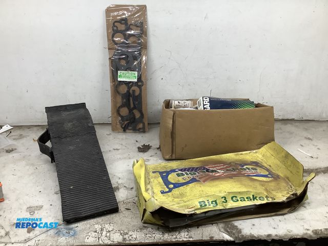 Lot 2-35679 - Lot of vehicle parts, including gm head gaskets, intake kits, and 1 car ramp.