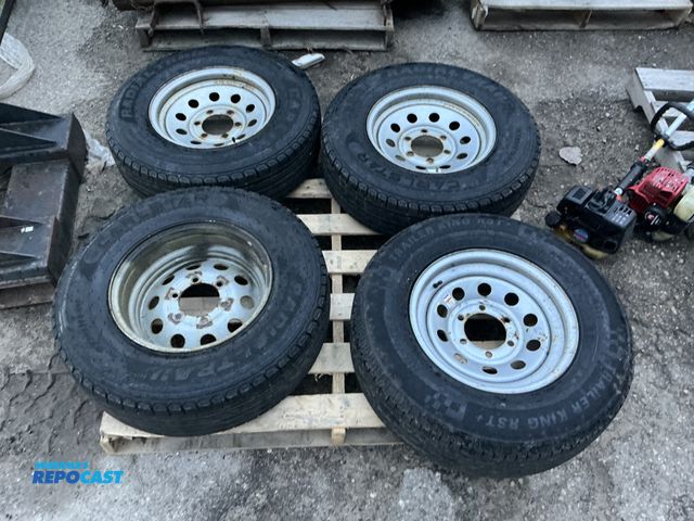 Lot 2-94518 - Skid lot of (4) tires w/ rims - (3) Carlstar Radial Trail ST225/75R15, &amp; (1) Trailer King RST+ S...