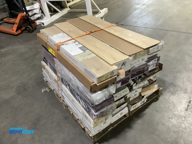 Lot 2-34947 - Skid lot of assorted laminate wood floor boards including: traffic master, rock wood oak, lark mead ...