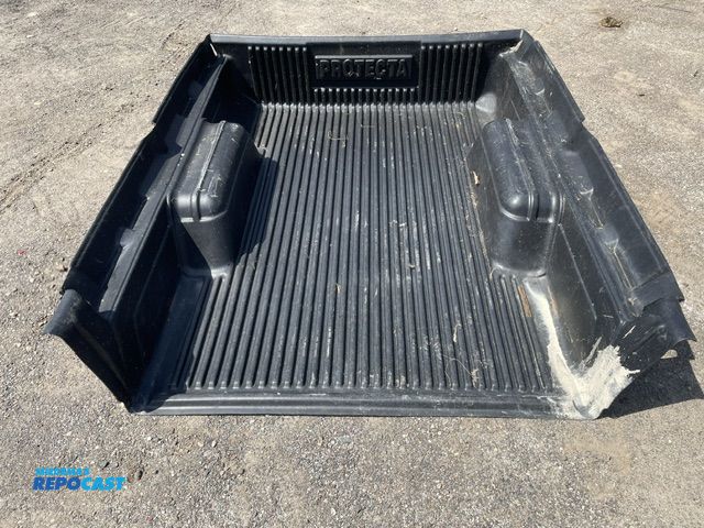 Lot 2-72733 - Used Protecta plastic bed liner, 73'' long x 64 1/2'' wide, 37 1/4'' between wheel wells,