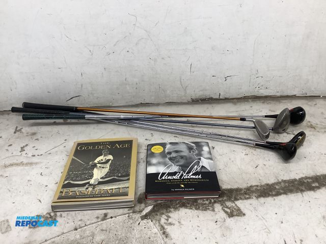 Lot 2-19661 - 1 Arnold Palmer book, 1 The Golden Age Of Baseball book, 2 drivers, a 3 wood, a 4 wood, and a 5 wood