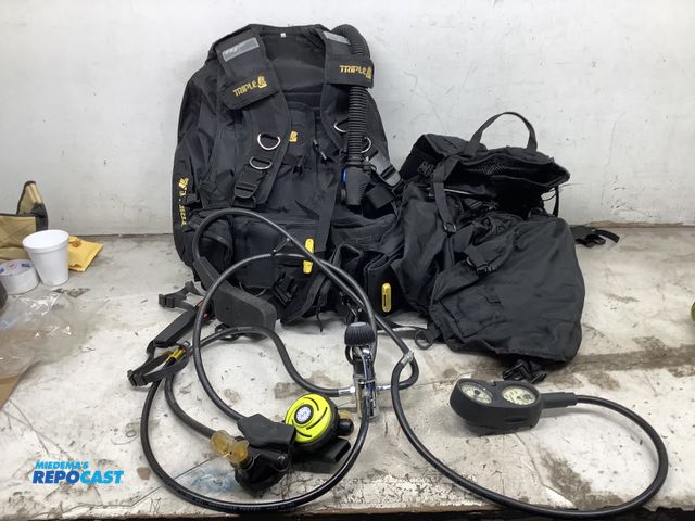 Lot 2-75573 - One Dive Caddy and one Triple scuba diving pack, a knife (with case), and (2) scuba diving oxygen gu...