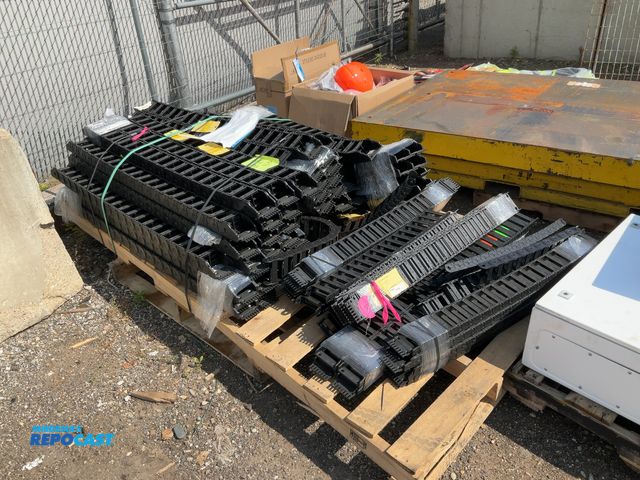 Lot 2-99059 - Skid of black igus plastic cable chains, all around 39” long and 2.75” wide