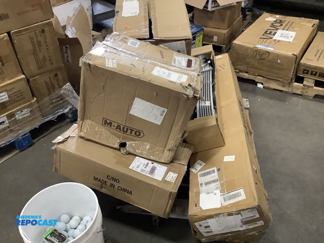 Lot 2-76264 - Skid lot of vehicle items including headlights, drive shaft, propeller shaft, inter cooler, radiator...