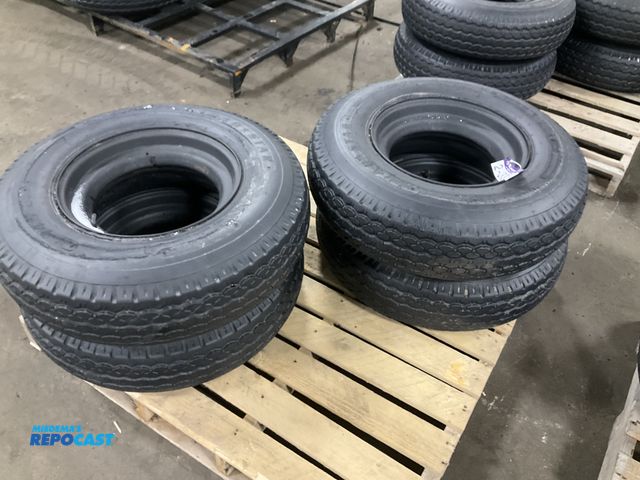 Lot 2-33500 - (4) 8-14.5 tires on steel mobile home style wheels, used