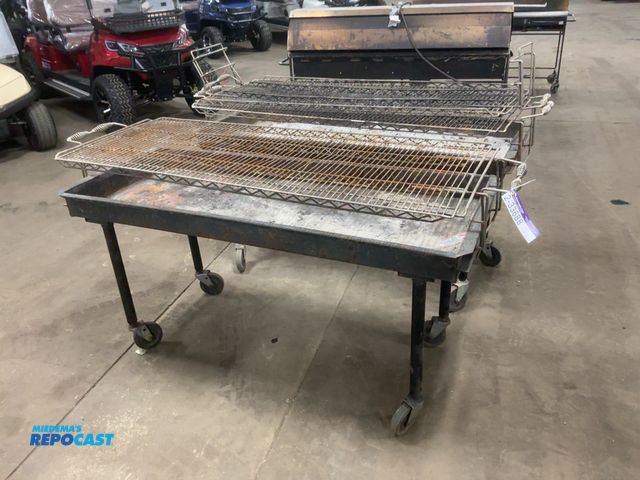 Lot 2-33688 - (2) Used 5’ Charcoal Grills, on casters, 24”x60” grill area, come with extra grate, showing wear/dam...