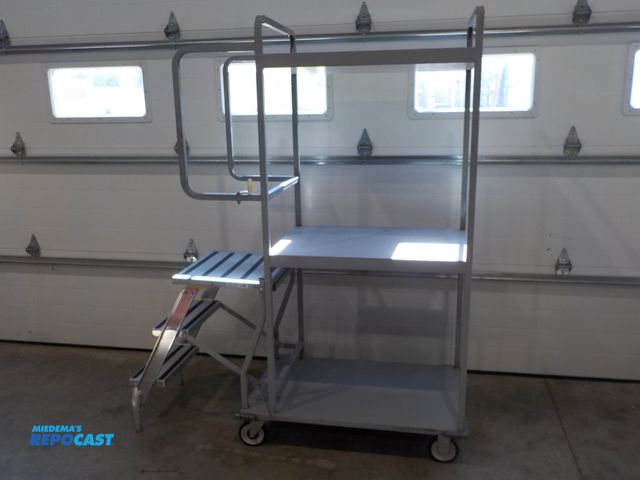 Lot 2-34112 - Commercial National Cart Company stocking cart. Three shelves. 300 pound rated steps. Locking castor...