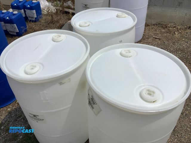 Lot 2-64386 - lot of 3 55 gallon white plastic barrels with 2 removable bungs, contained mineral oil