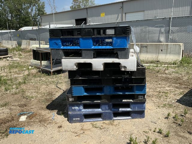 Lot 2-28655 - Stack of (10) blue, white, and black plastic stackable skids approx 43” x 43” x 5” - various conditi...