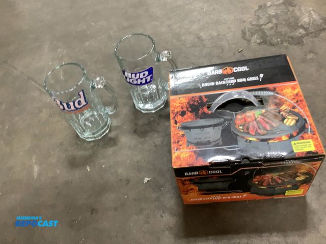 Lot 2-33893 - Barb cool Round backyard bbq grill and (2) bud light beer glasses