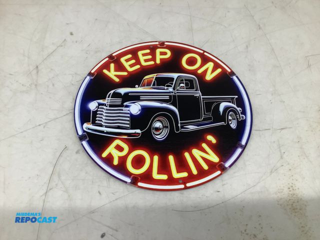Lot 2-74497 - New 7.75” Diameter Circular Metal “Keep On Rolling” Sign with Pre-Drilled Holes for Hanging