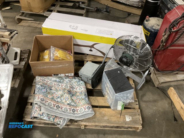 Lot 2-67878 - Skid lot includes a rug, a fan, a car radio, and more