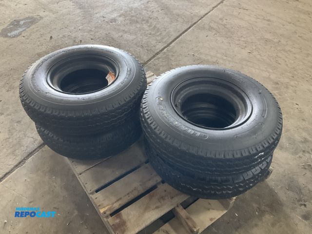 Lot 2-42700 - (4) 8-14.5 tires on steel mobile home style wheels, used