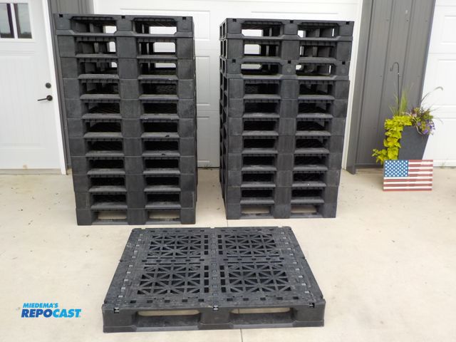 Lot 2-33535 - Lot of (23) plastic 4-way pallets. 48 in x 40 in . Few chips and cracks. National Pallet Company.