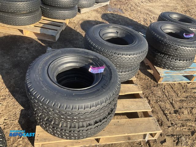 Lot 2-23680 - (4) 8-14.5 tires on steel mobile home style wheels, used